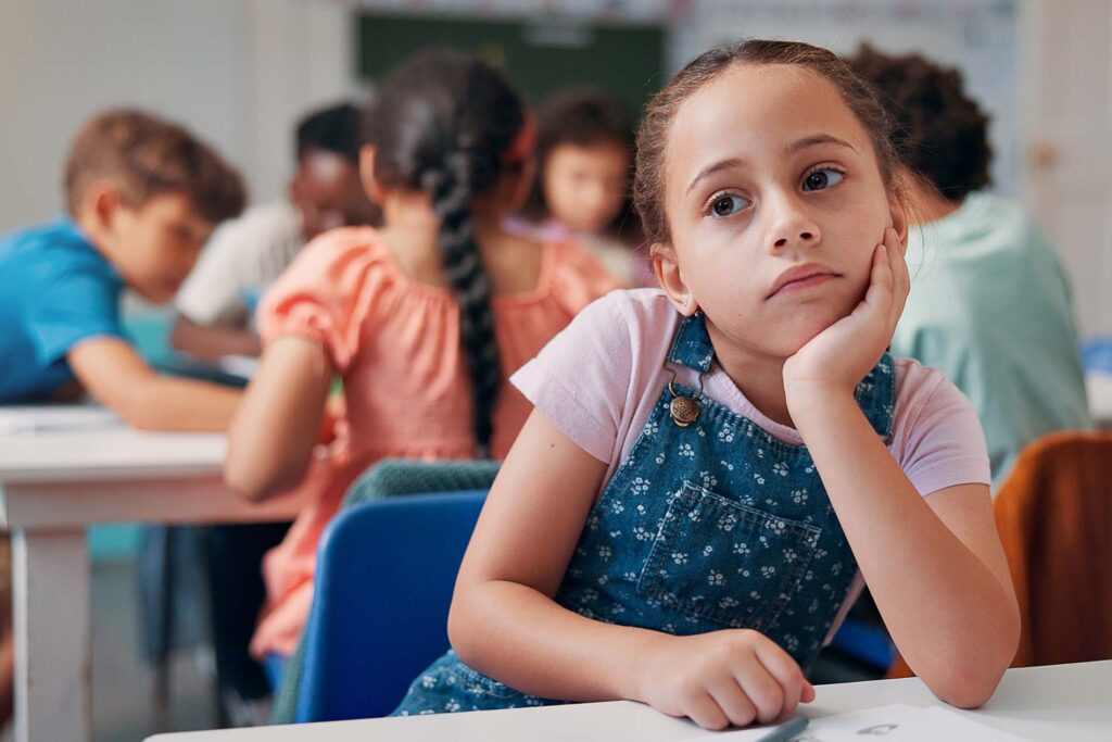 Bored, thinking and student with girl in classroom for education, learning disorder and future. Problem solving, mental health and reflection with child with adhd in school for studying and idea