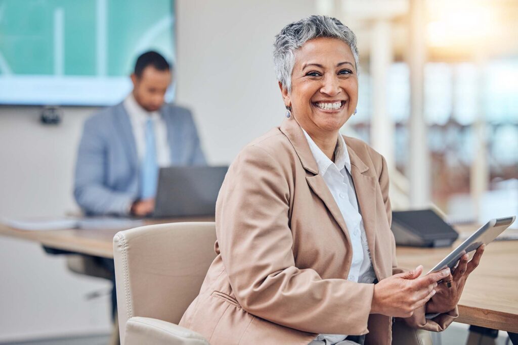 Portrait of woman in office with tablet, business people and smile, leadership at startup agency. Workshop, presentation and face of happy businesswoman, professional with opportunity and development