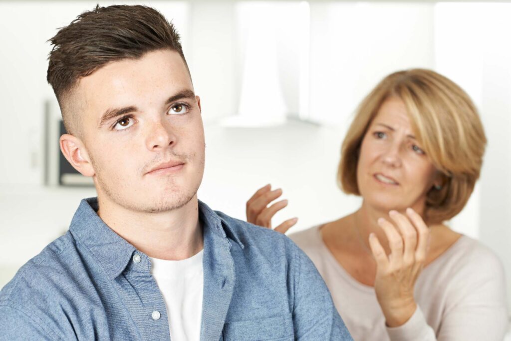 annoyed teen boy and mom web