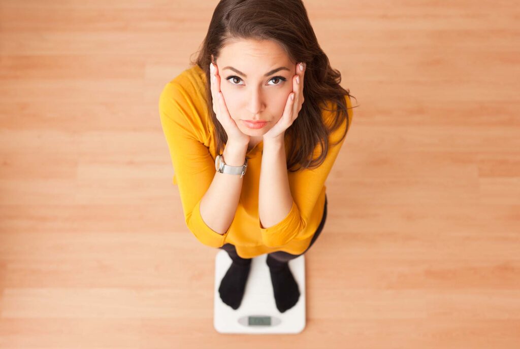 eating disorder girl on scale sm